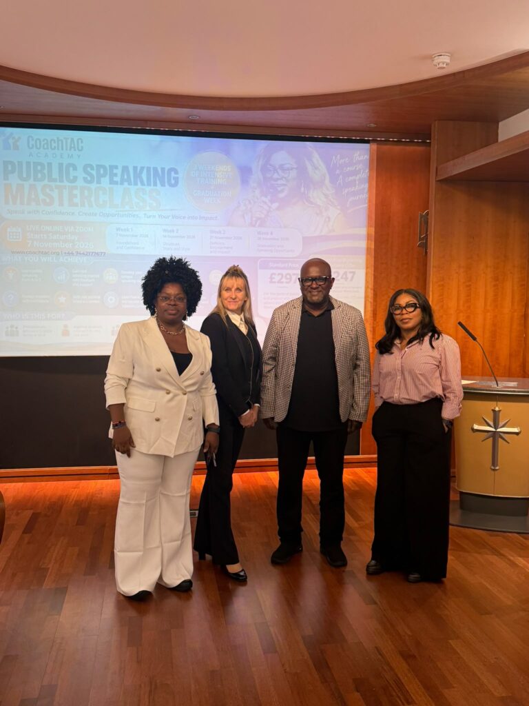 A small group poses with Titilola Aboyade-Cole after the workshop.