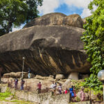 Visitors exploring the granite formations and pathways at Olumo Rock in Abeokuta.