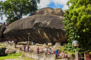 Visitors exploring the granite formations and pathways at Olumo Rock in Abeokuta.