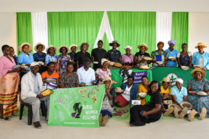 Members of the Rural Women Assembly gather with woven baskets in Zimbabwe