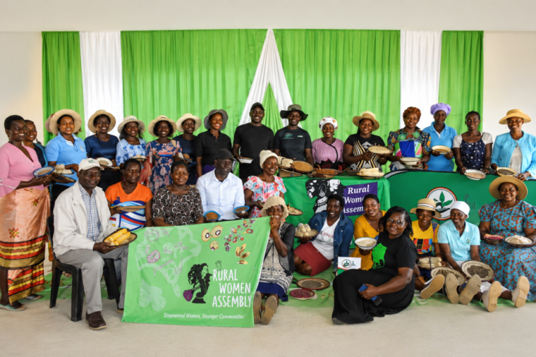 Members of the Rural Women Assembly gather with woven baskets in Zimbabwe