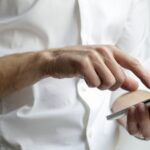 A person using a smartphone, illustrating mobile-message security