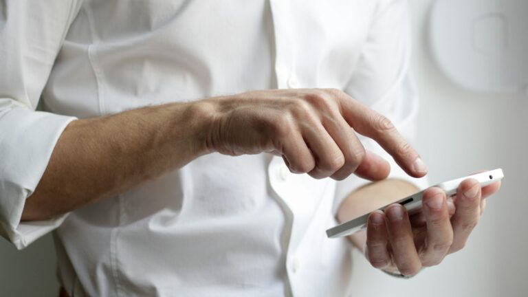 A person using a smartphone, illustrating mobile-message security