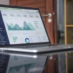 Business professional reviewing digital marketing analytics on a laptop