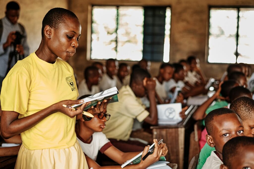 Students seated in a Nigerian classroom during an education charity visit