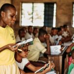 Students seated in a Nigerian classroom during an education charity visit