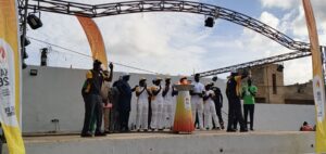 Dakar 2026 flame relay participants around a ceremonial cauldron in Diamniadio on 26 September 2026