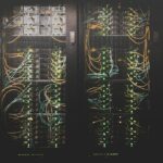 Rows of illuminated data-centre servers used for artificial intelligence infrastructure