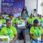 Abiola Arogundade with participants and sewing machines at the Enugu skills training programme