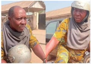 Ezekiel Atilola, known as Tombolo, pictured holding and wearing a motorcycle helmet
