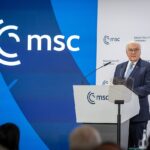 German President Frank-Walter Steinmeier speaking at a podium