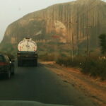 Traffic on the Kaduna-Abuja highway near Zuma Rock in December 2018, an archive location photograph.