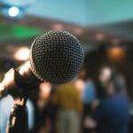 Microphone under stage lights illustrating live Afrohype performance