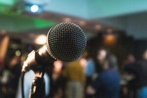 Microphone under stage lights illustrating live Afrohype performance