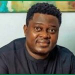 Nollywood actor Muyiwa Ademola wearing a dark shirt in a seated portrait.