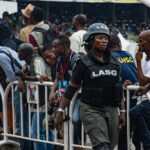 Nigeria Police officers at Tafawa Balewa Square, Lagos, in 2016; archival illustration of policing