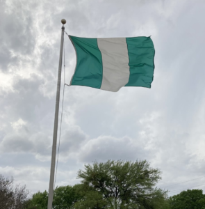 Nigerian flag on an outdoor flagpole, photographed in April 2022