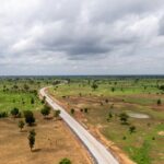 Aerial view of a Nigerian highway through open countryside