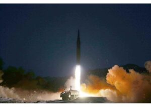 A North Korean ballistic missile launching from a mobile platform at night