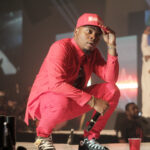 Olamide holding a microphone at Olamide Live In Concert on 28 December 2014.