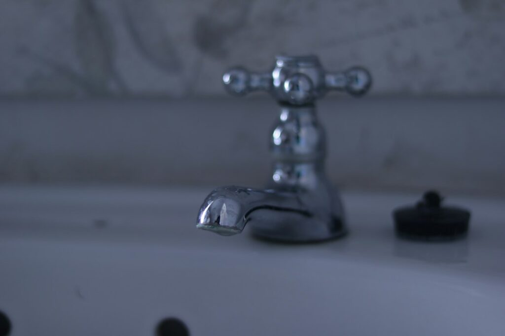 Water flowing from a tap, illustrating Lagos public water supply