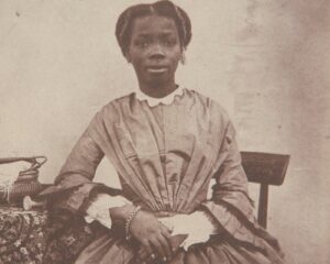 Sarah Forbes Bonetta, born Àìná, seated in a Victorian dress in a portrait by William Bambridge