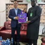 NFVCB chief Shaibu Husseini with Bai Yimin during talks on Nollywood distribution in Abuja