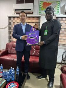 NFVCB chief Shaibu Husseini with Bai Yimin during talks on Nollywood distribution in Abuja