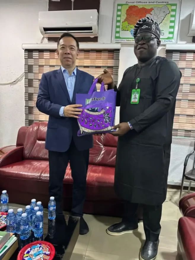 NFVCB chief Shaibu Husseini with Bai Yimin during talks on Nollywood distribution in Abuja