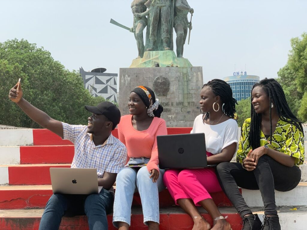 University students using laptops together during a study session
