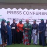 Women gather for a group photograph at the Abuja press conference marking the anniversary of UN Security Council Resolution 1325.