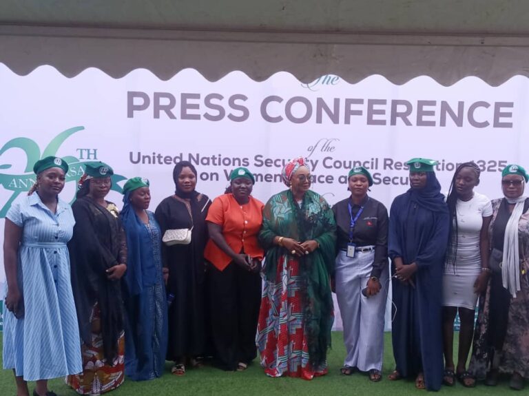 Women gather for a group photograph at the Abuja press conference marking the anniversary of UN Security Council Resolution 1325.