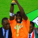 Archive photograph of Yaya Toure lifting the Africa Cup of Nations trophy for Ivory Coast on 8 February 2015