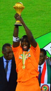 Archive photograph of Yaya Toure lifting the Africa Cup of Nations trophy for Ivory Coast on 8 February 2015