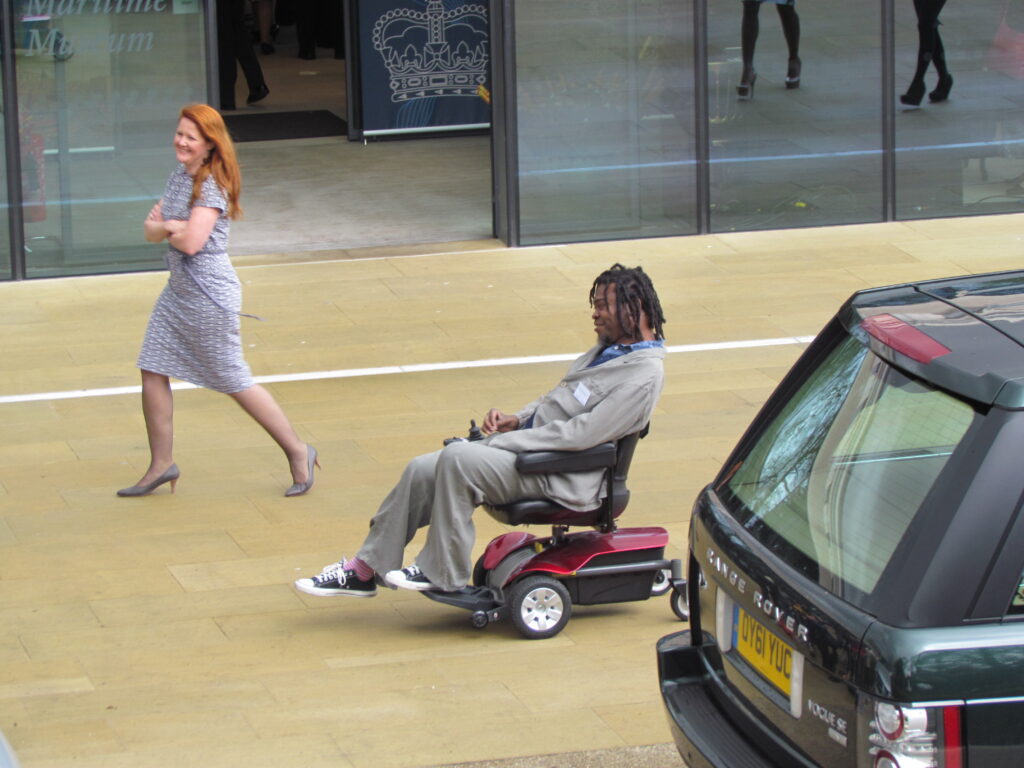 Yinka Shonibare seated at an event, photographed on 25 April 2012