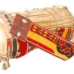 Yoruba talking drum with tension cords, decorated straps and bells, photographed in 2017; illustrative object, not from Aafin Ilu.