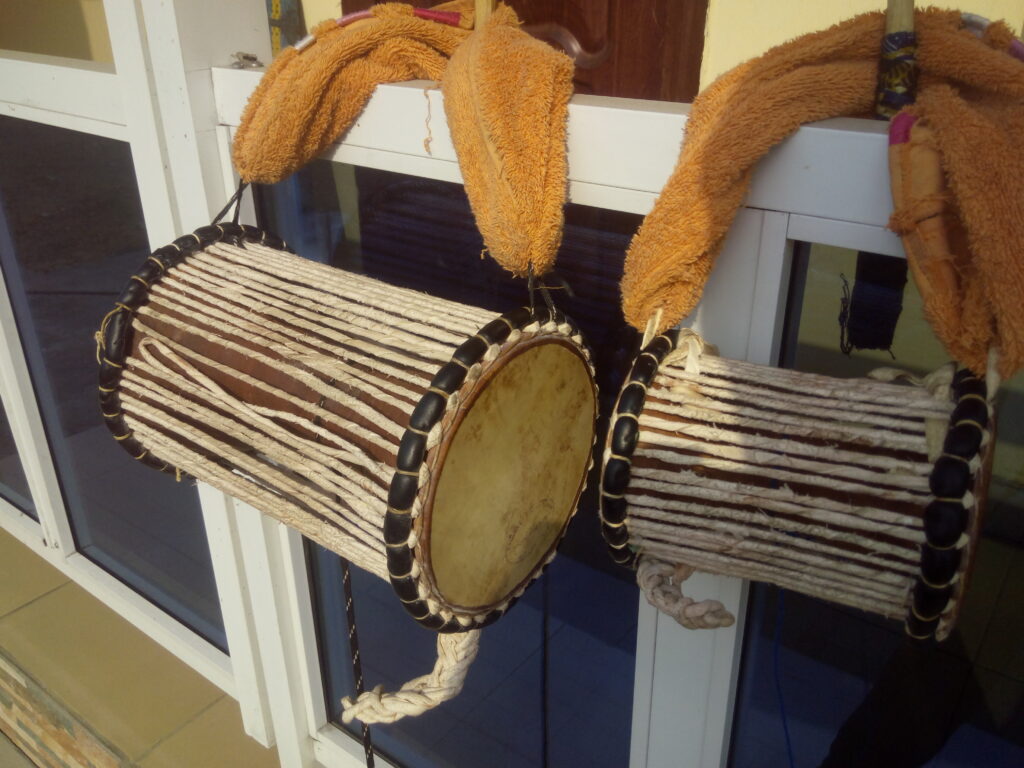 Yoruba talking drum with a smaller omele drum in western Nigeria